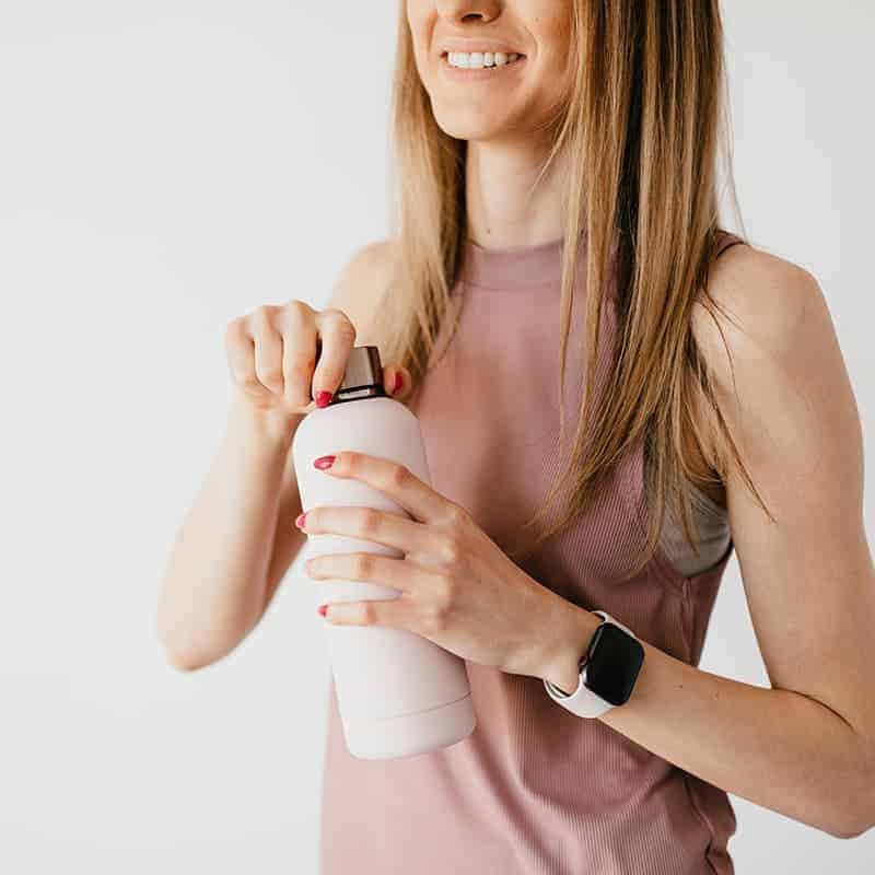 woman with a water bottle in her hand