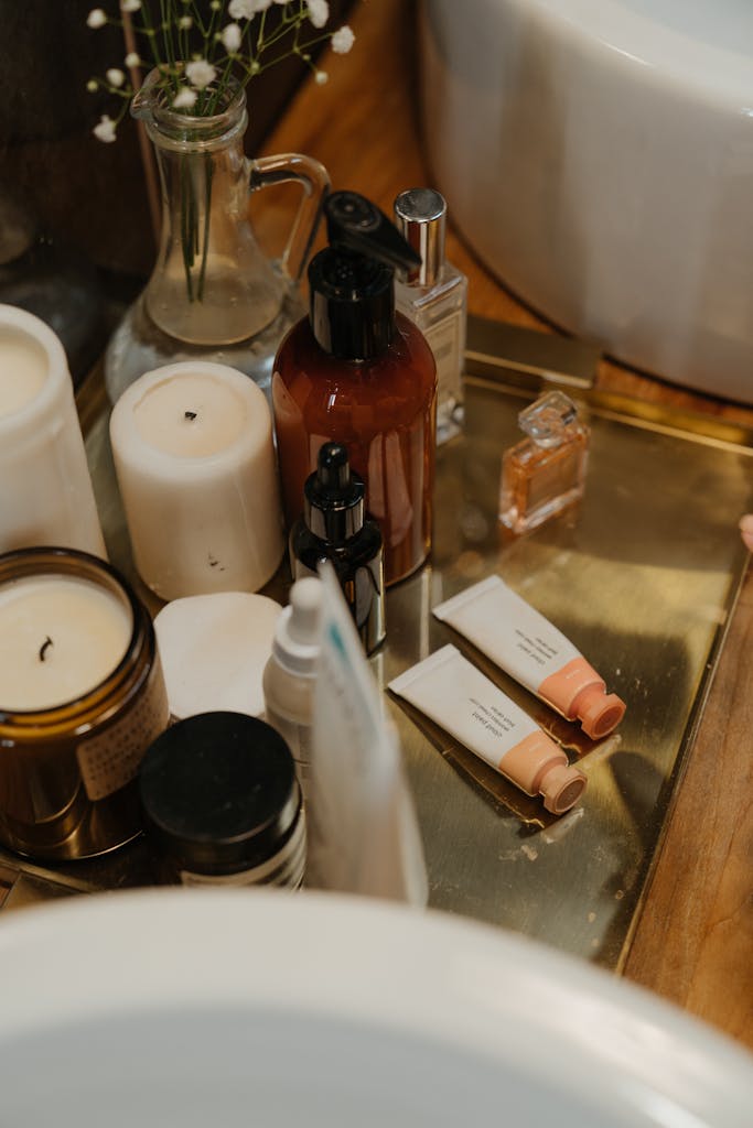 White and Brown Bottles  showing skincare labels on Brown Wooden Table