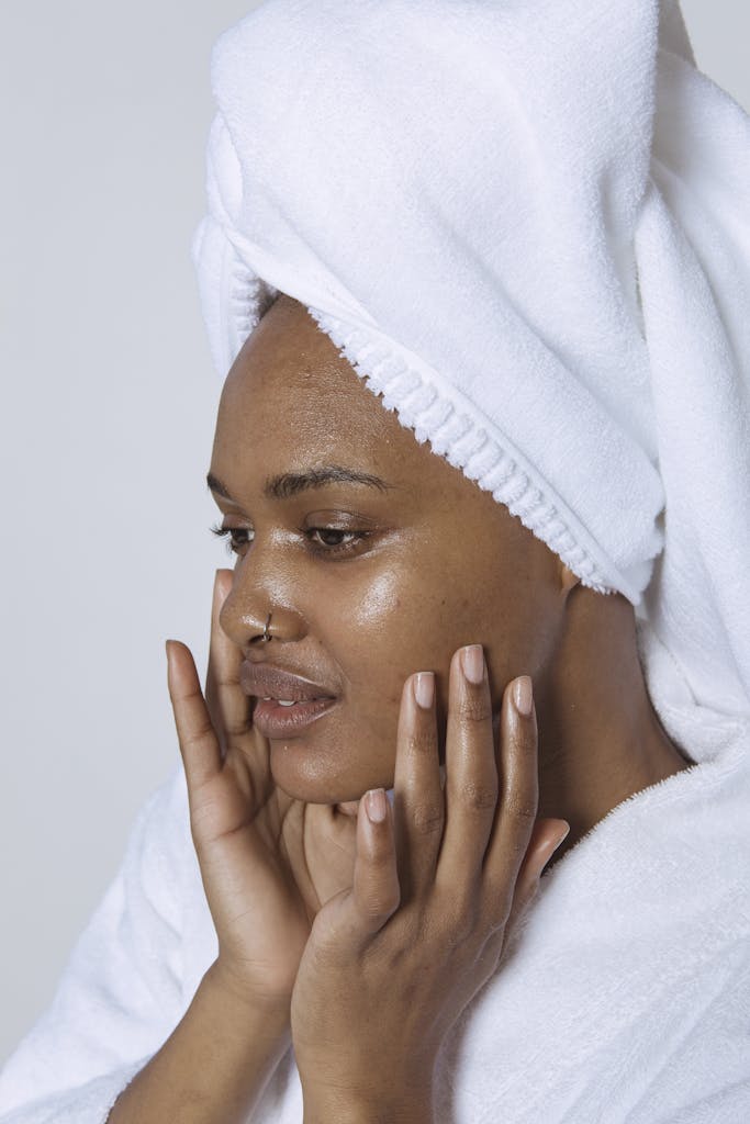 African American woman completing her minimalist organic skincare routine