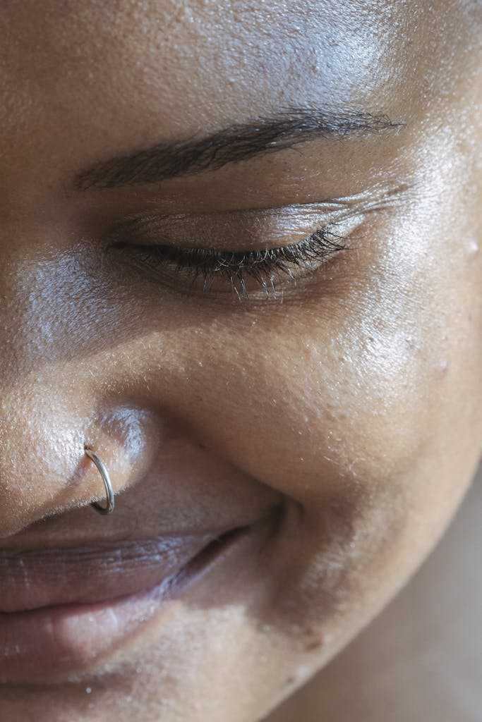 Crop cheerful ethnic lady with closed eyes