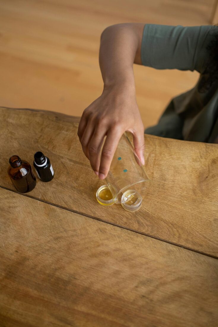 Pouring Homemade Lip Balm into Containers