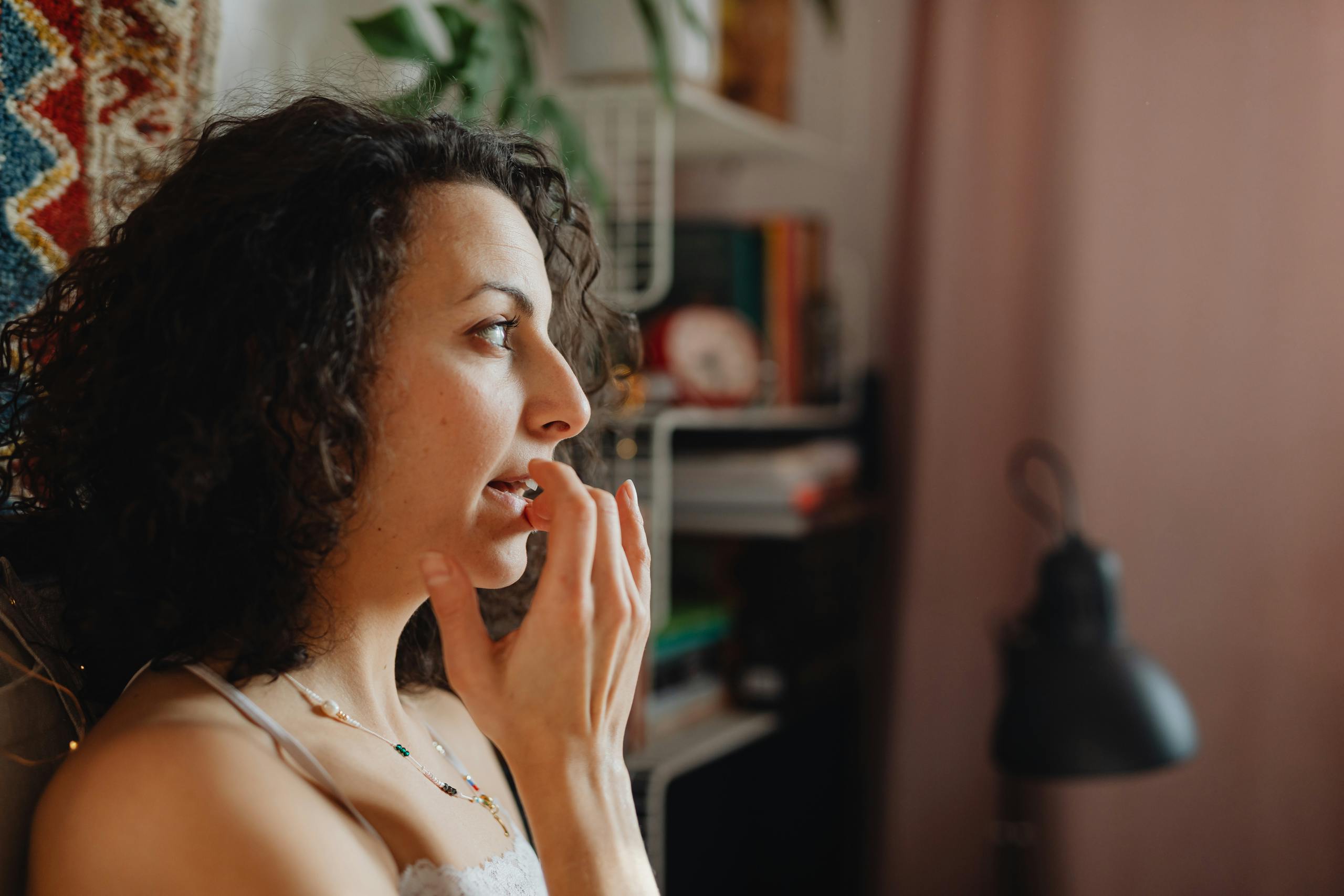 Woman Applying Lip Balm