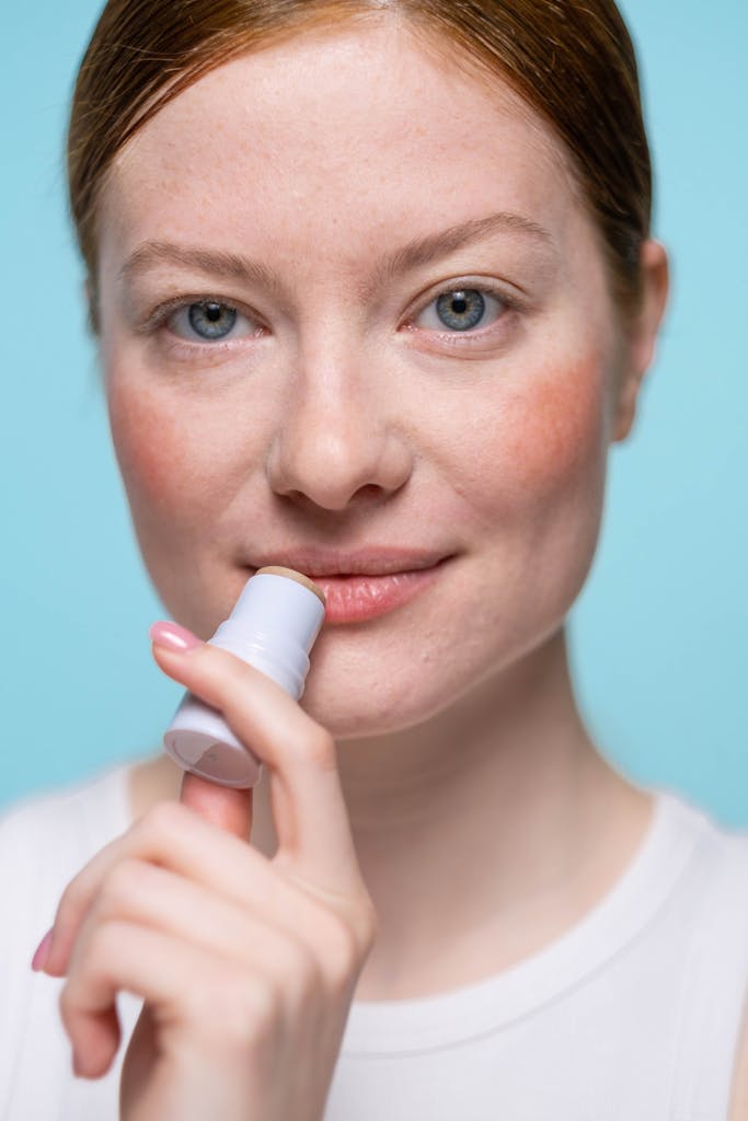 Woman Applying espresso Lip Balm